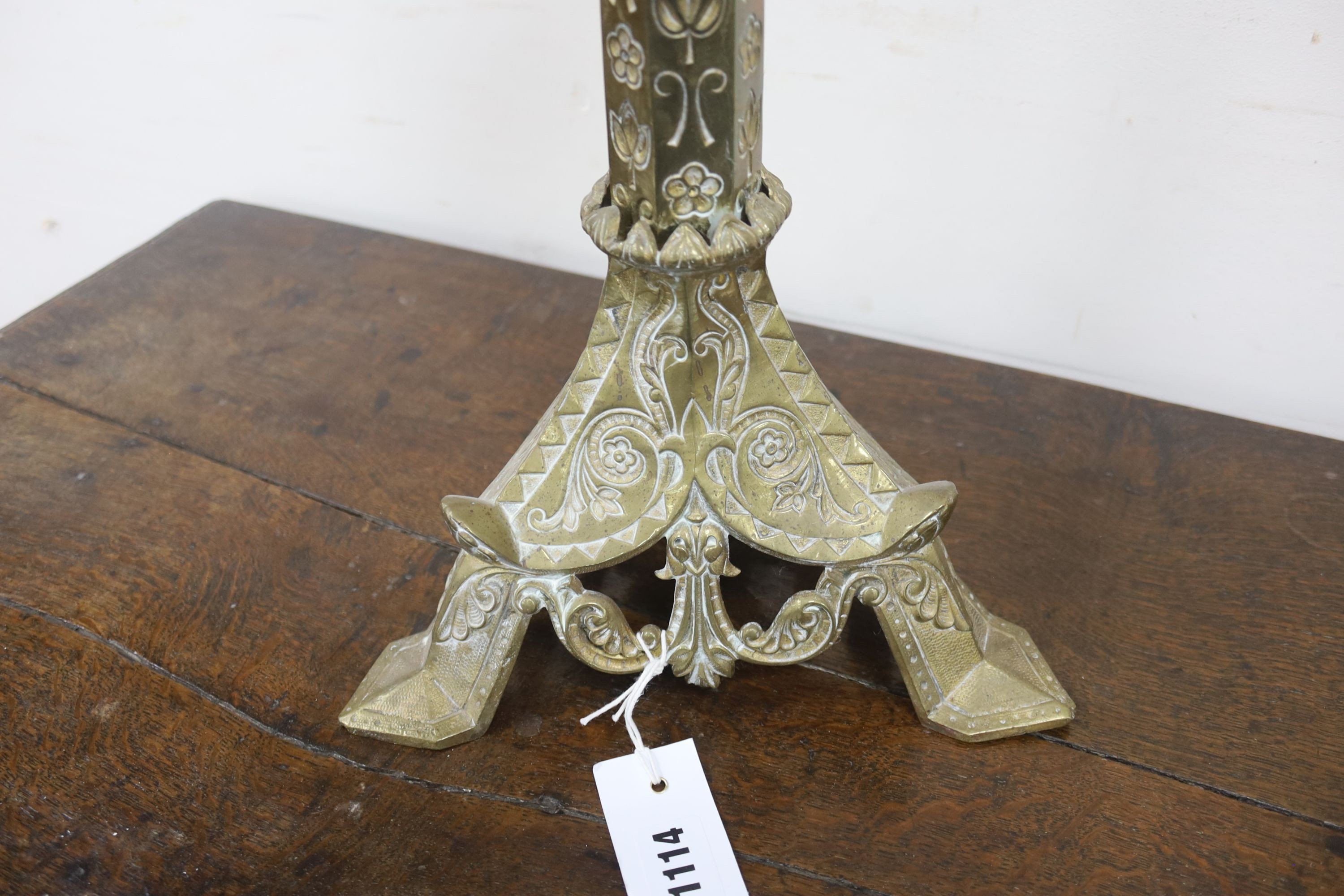 A brass eclisiastical candlestick, height 82cm